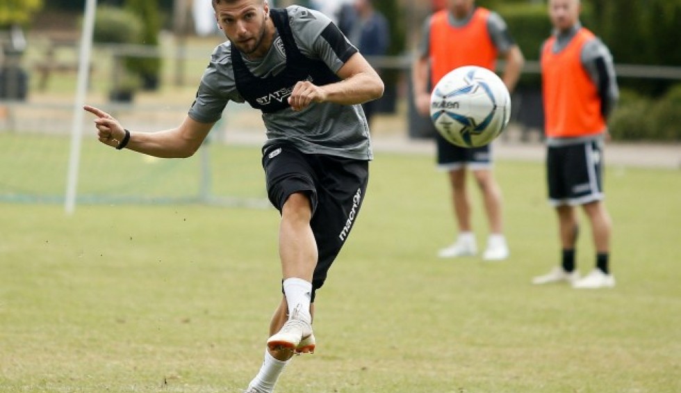 A generic square placeholder image with rounded corners in a figure.