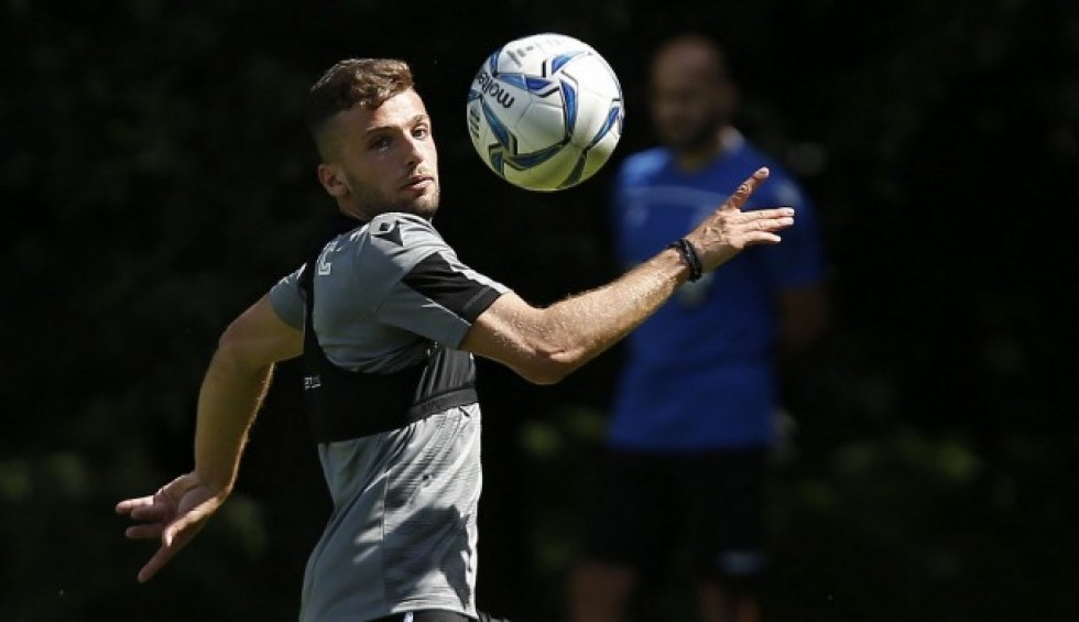 A generic square placeholder image with rounded corners in a figure.