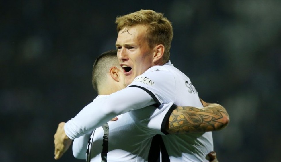 A generic square placeholder image with rounded corners in a figure.