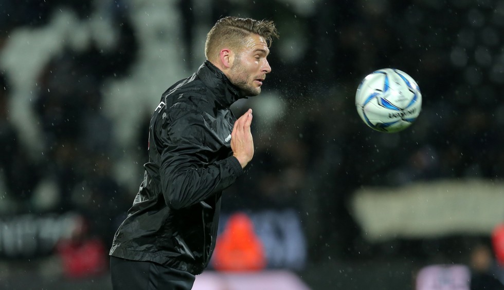 A generic square placeholder image with rounded corners in a figure.