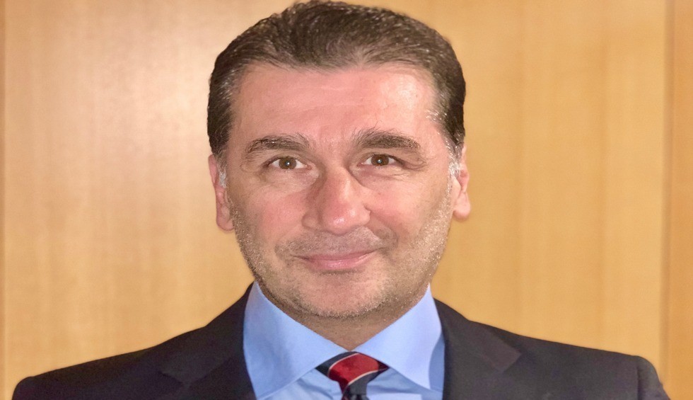 A generic square placeholder image with rounded corners in a figure.