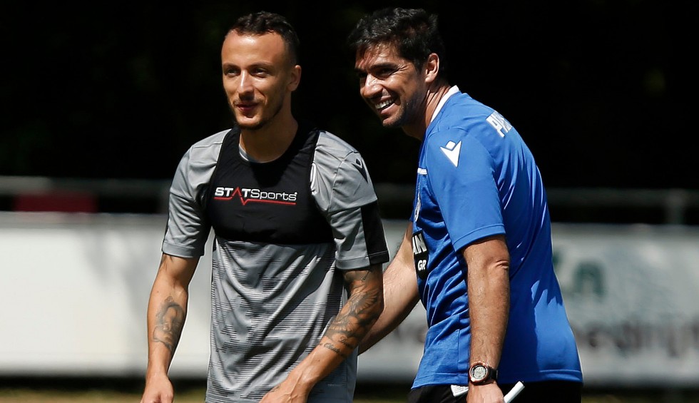 A generic square placeholder image with rounded corners in a figure.