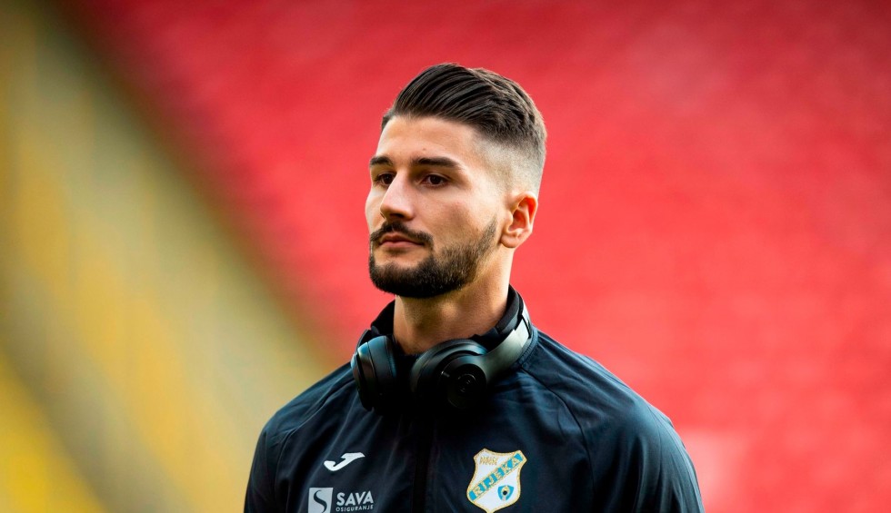 A generic square placeholder image with rounded corners in a figure.