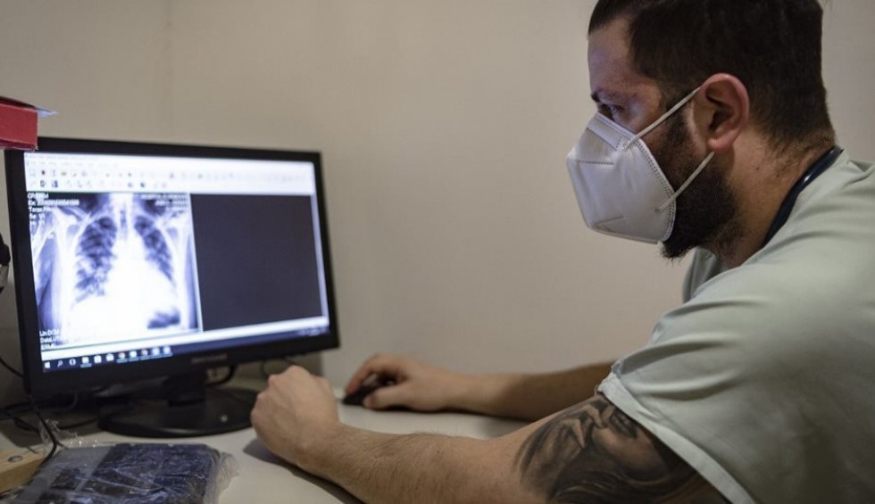 A generic square placeholder image with rounded corners in a figure.