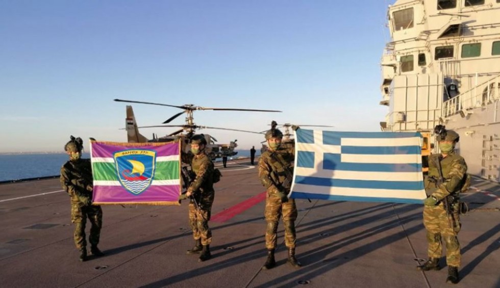 A generic square placeholder image with rounded corners in a figure.