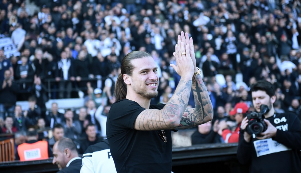 A generic square placeholder image with rounded corners in a figure.