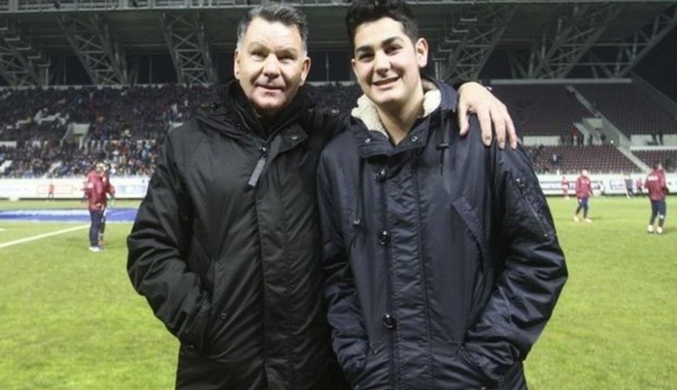 A generic square placeholder image with rounded corners in a figure.