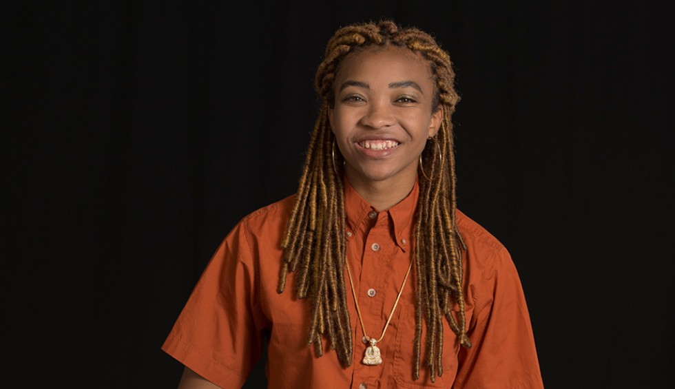 A generic square placeholder image with rounded corners in a figure.