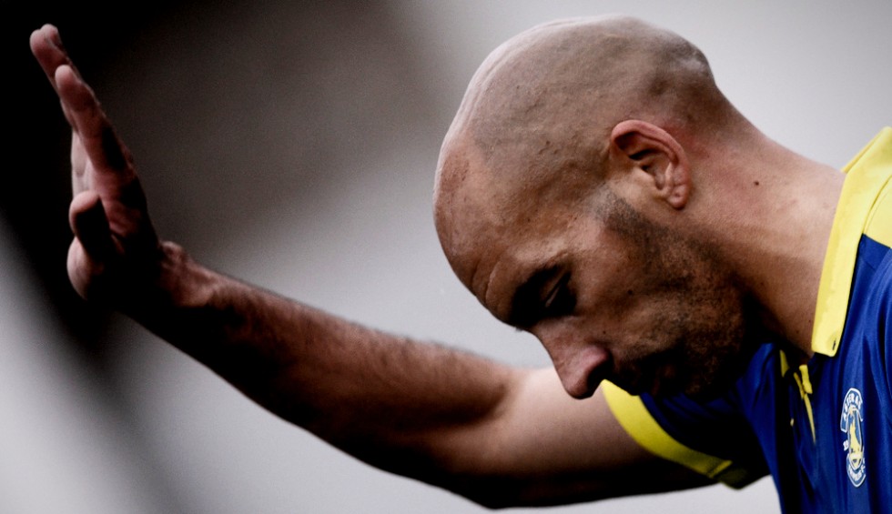 A generic square placeholder image with rounded corners in a figure.