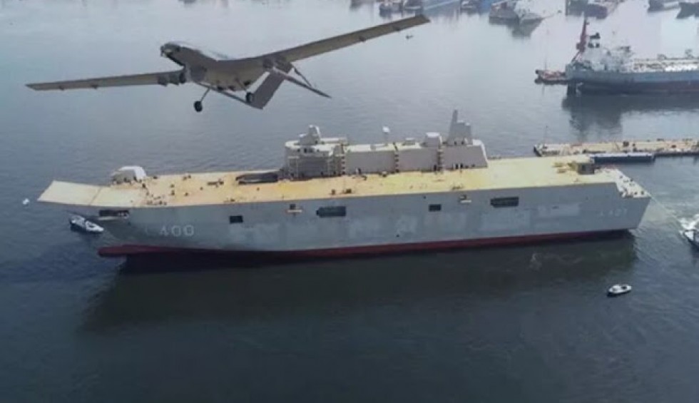 A generic square placeholder image with rounded corners in a figure.