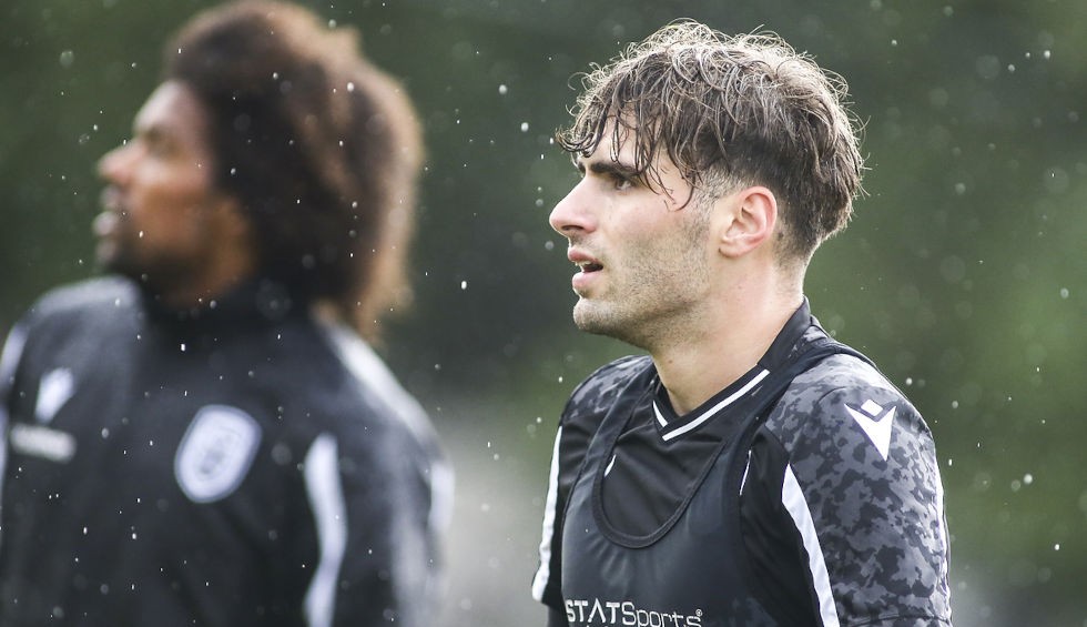 A generic square placeholder image with rounded corners in a figure.