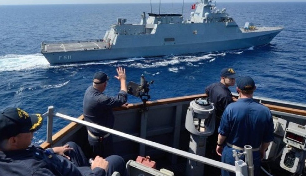 A generic square placeholder image with rounded corners in a figure.