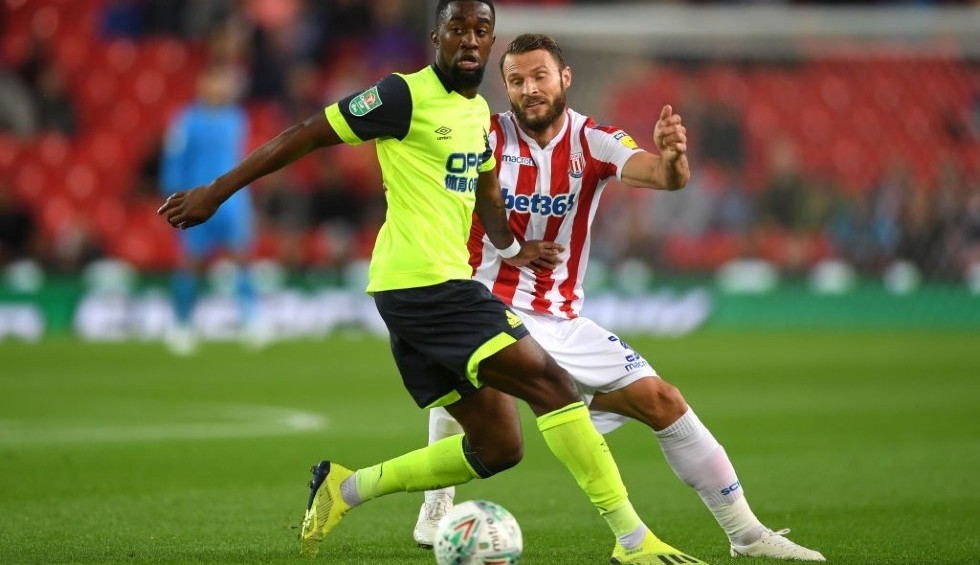 A generic square placeholder image with rounded corners in a figure.