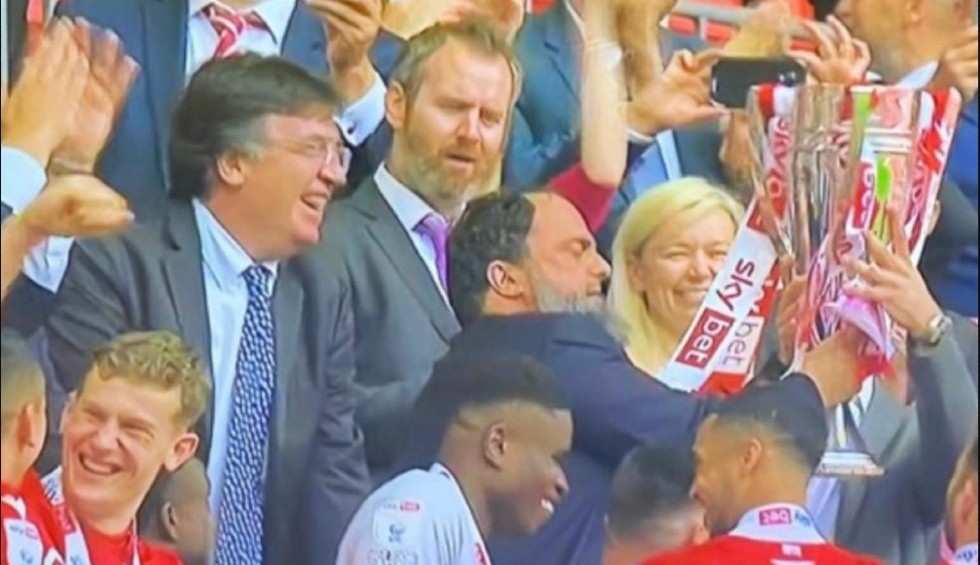 A generic square placeholder image with rounded corners in a figure.