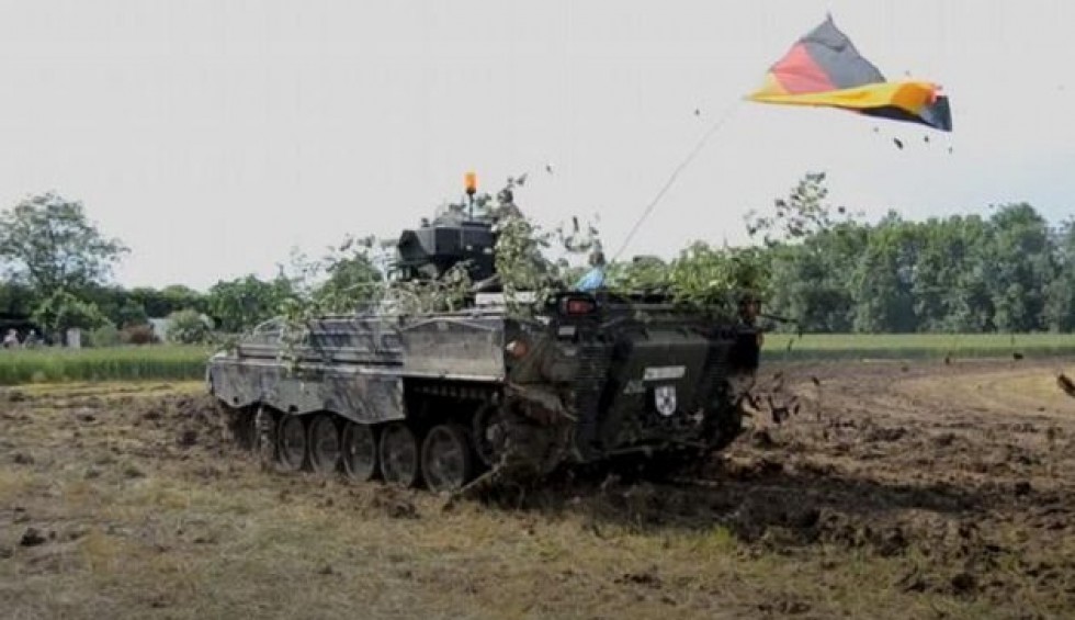 A generic square placeholder image with rounded corners in a figure.