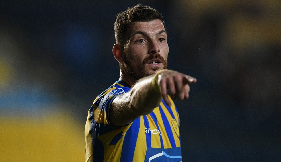 A generic square placeholder image with rounded corners in a figure.