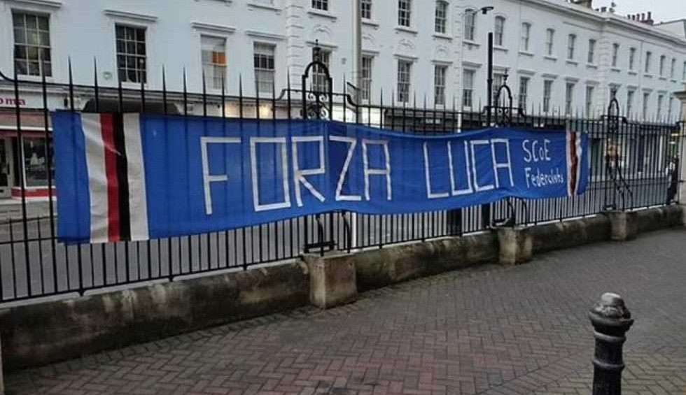 A generic square placeholder image with rounded corners in a figure.