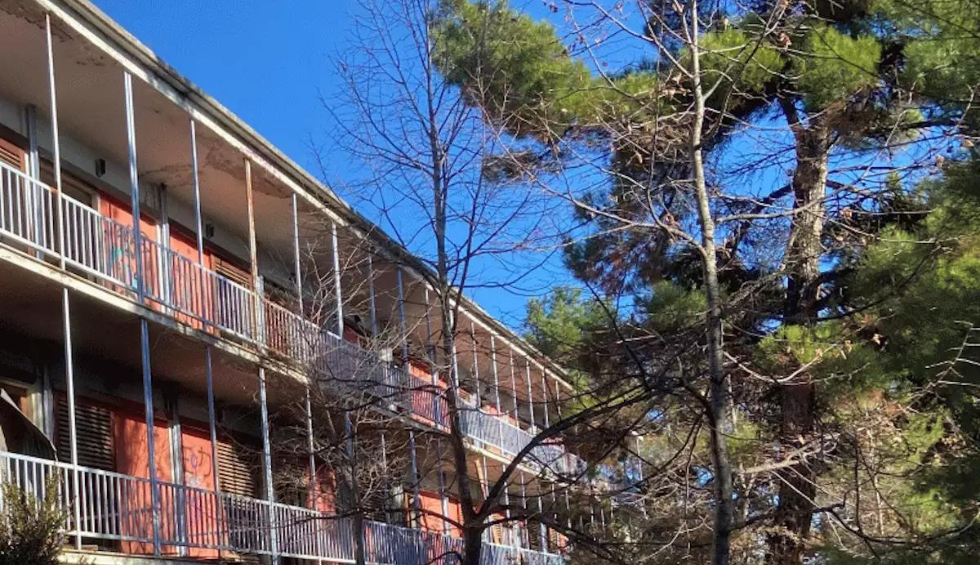 A generic square placeholder image with rounded corners in a figure.