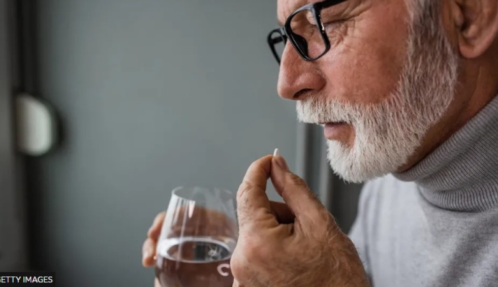 A generic square placeholder image with rounded corners in a figure.