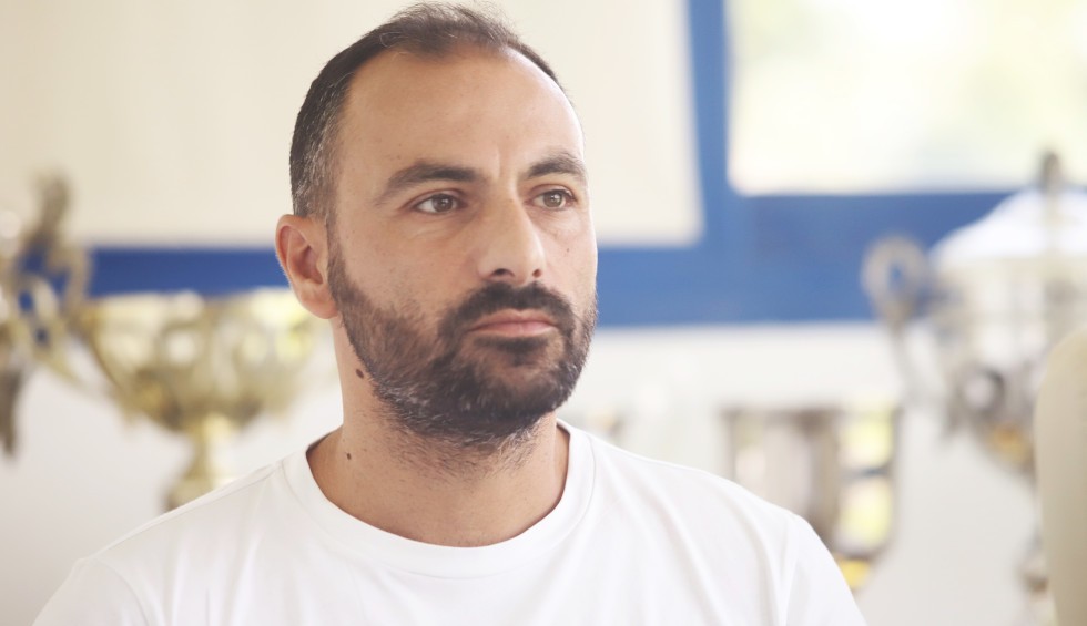 A generic square placeholder image with rounded corners in a figure.