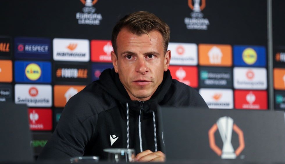 A generic square placeholder image with rounded corners in a figure.