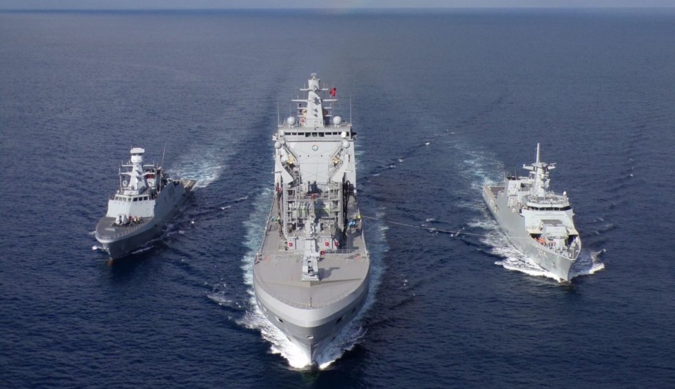 A generic square placeholder image with rounded corners in a figure.