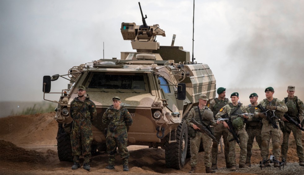 A generic square placeholder image with rounded corners in a figure.