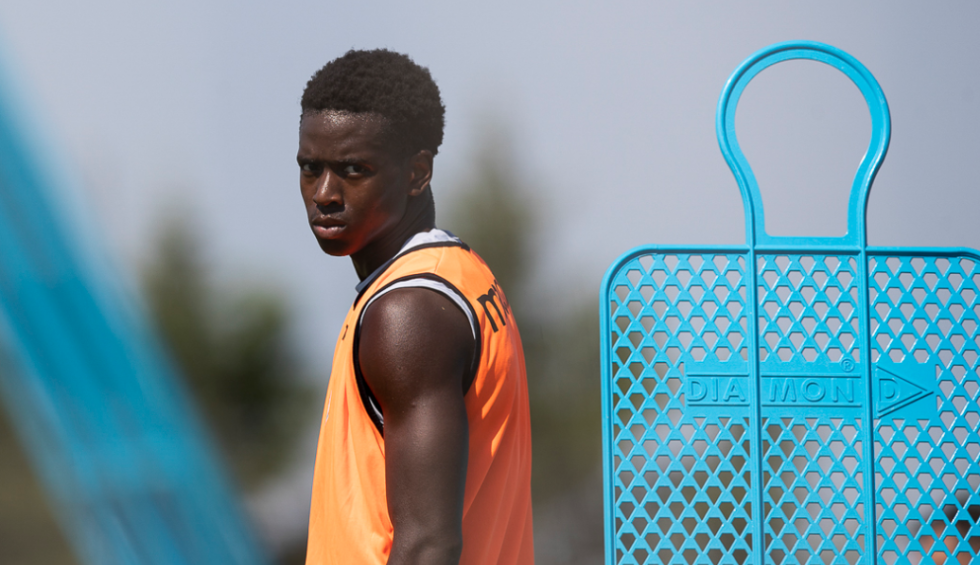 A generic square placeholder image with rounded corners in a figure.