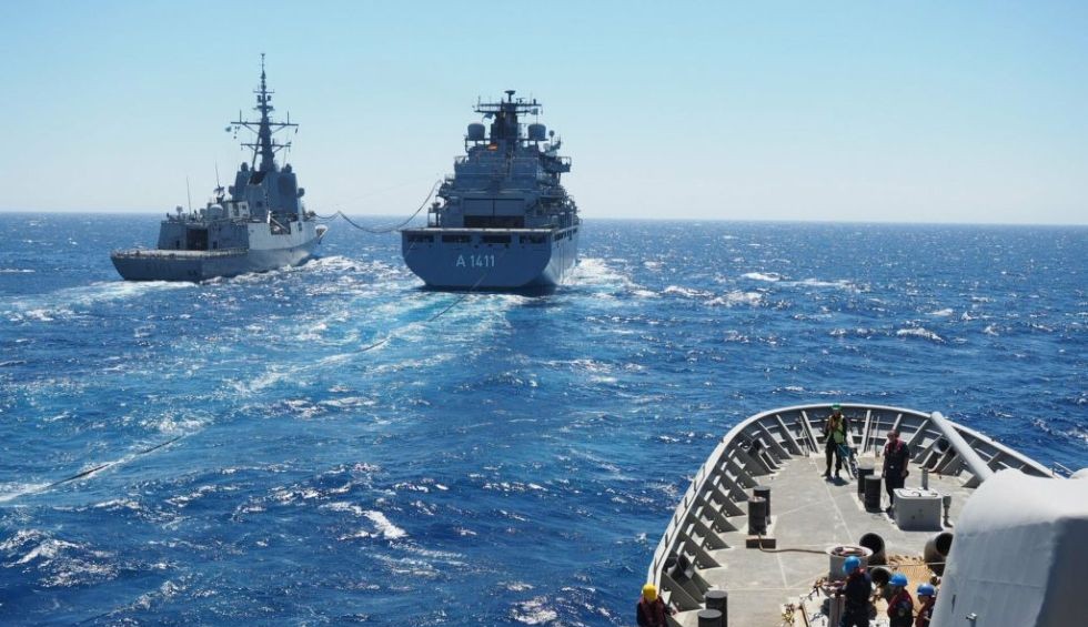 A generic square placeholder image with rounded corners in a figure.