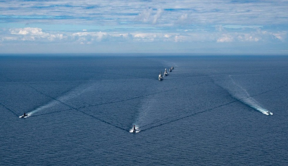 A generic square placeholder image with rounded corners in a figure.