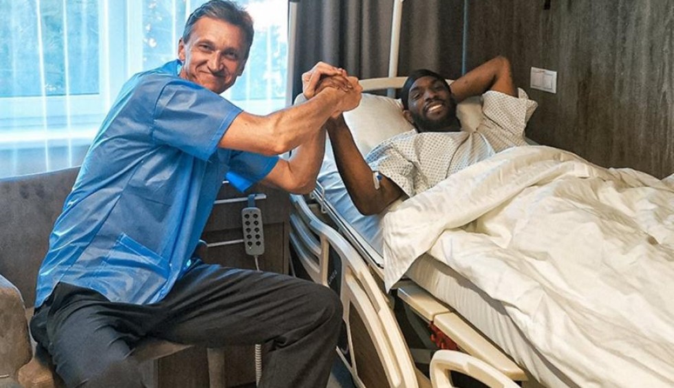 A generic square placeholder image with rounded corners in a figure.