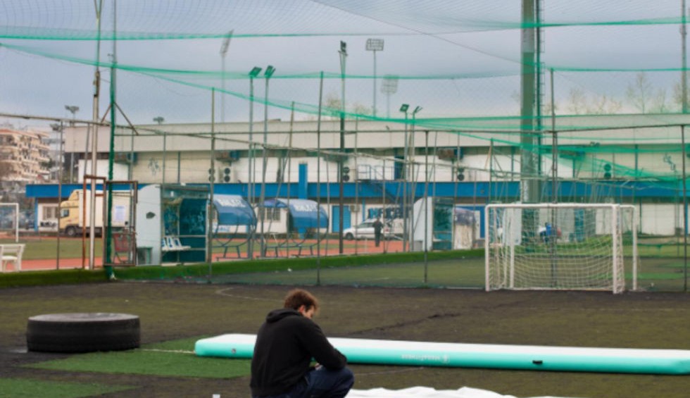 A generic square placeholder image with rounded corners in a figure.