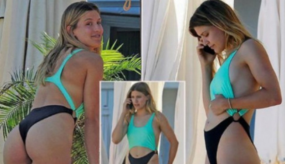 A generic square placeholder image with rounded corners in a figure.