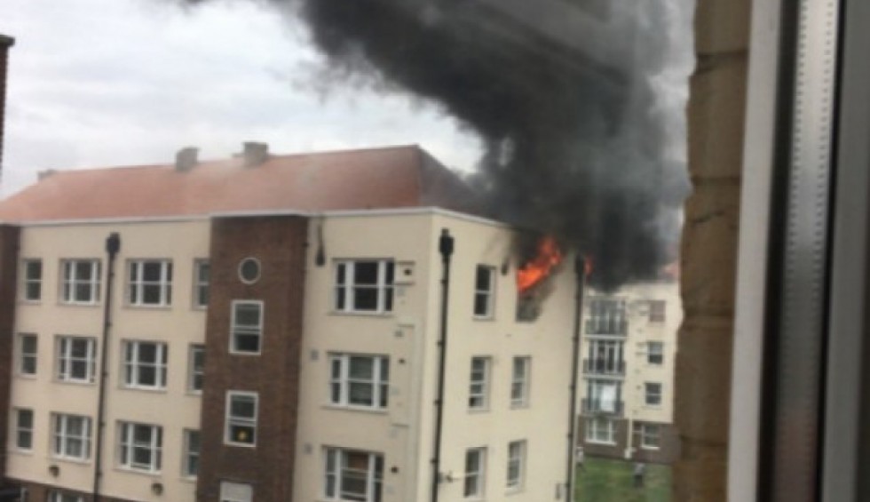 A generic square placeholder image with rounded corners in a figure.