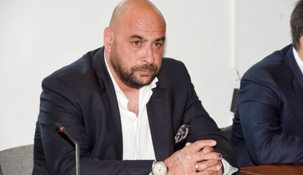 A generic square placeholder image with rounded corners in a figure.